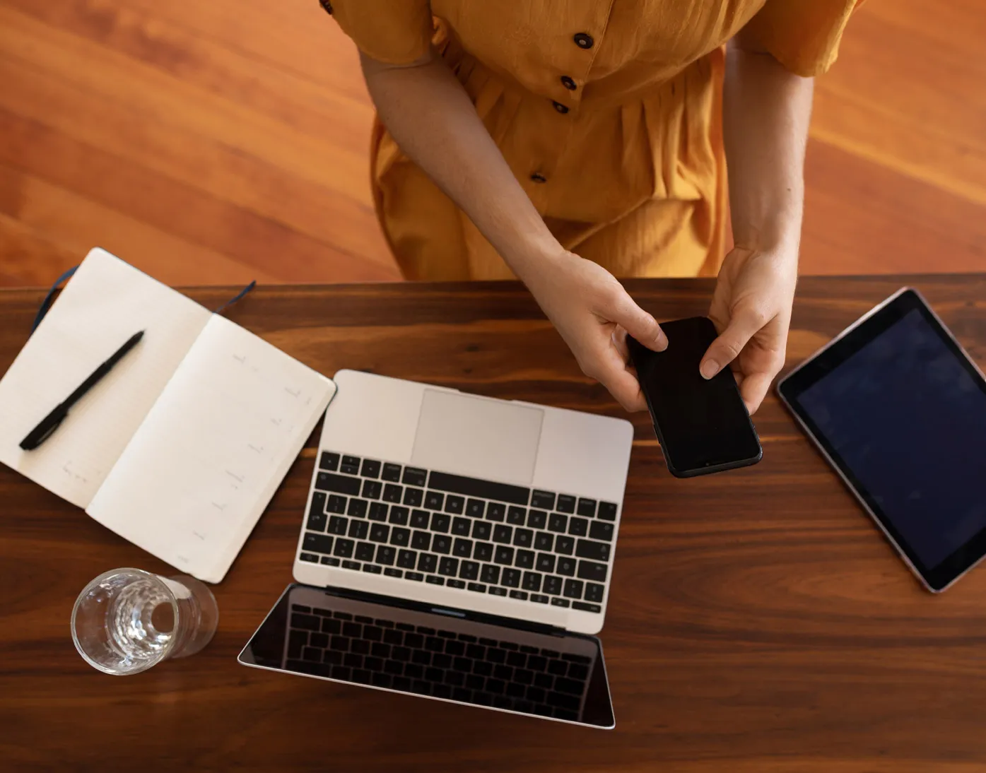 Internet Devices and notebook on a table