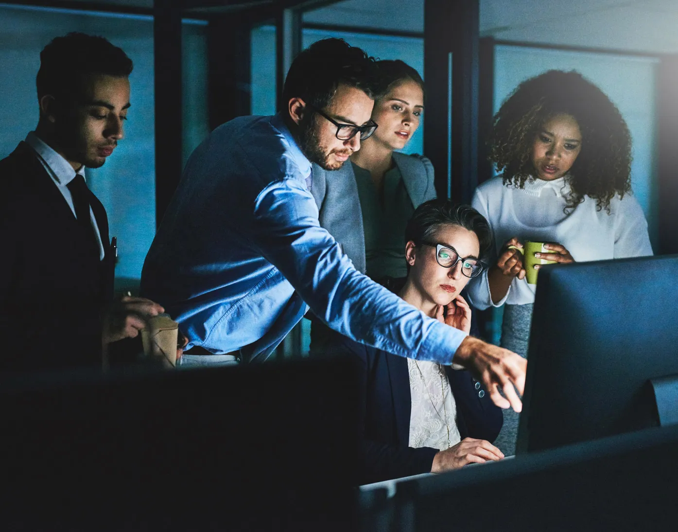 Work team looking at computer screen